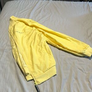 Never worn Yellow FRIENDS jacket . Central Perk on back